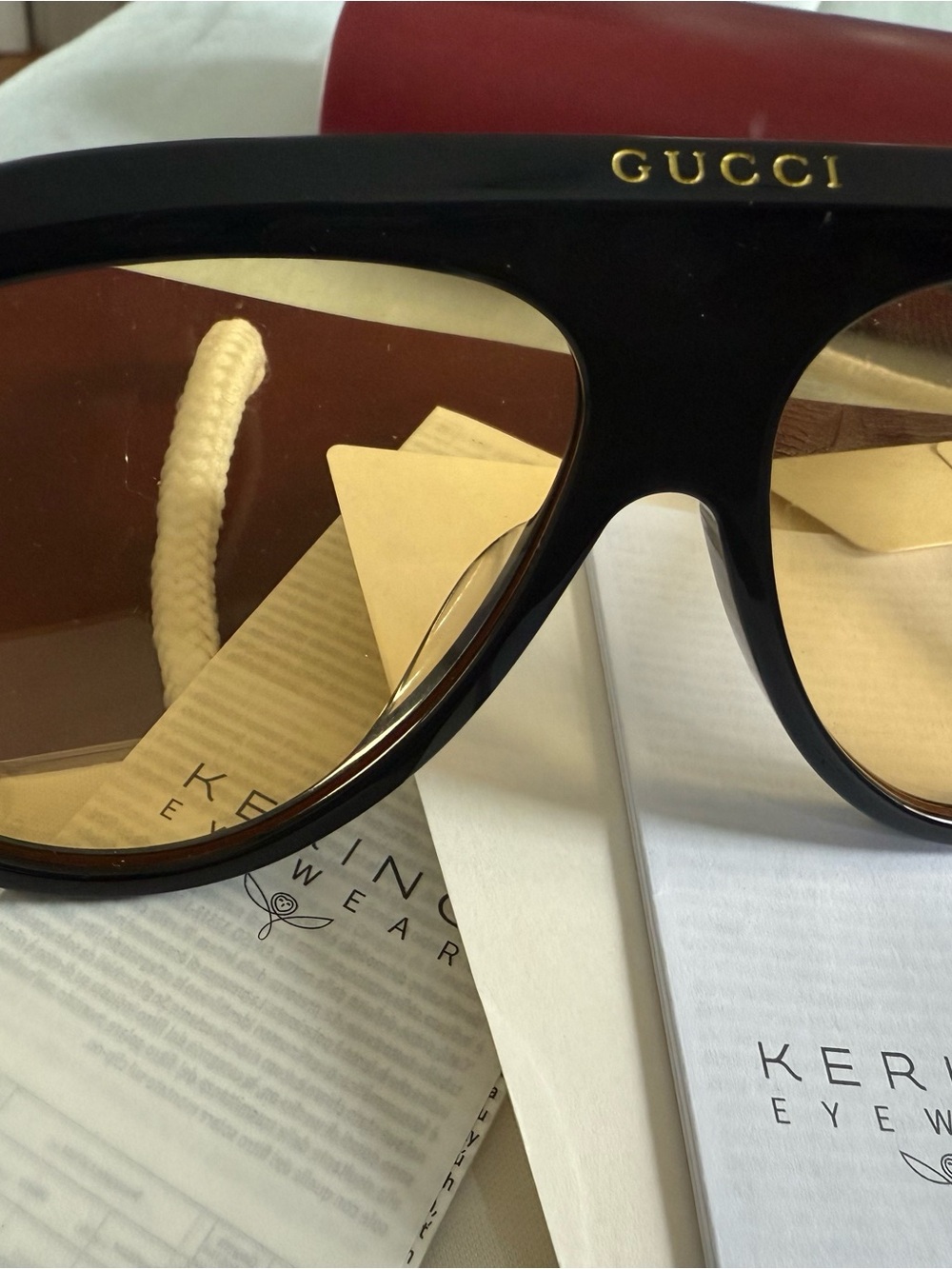 Gucci Black Frame Sunglasses with Brown Lenses